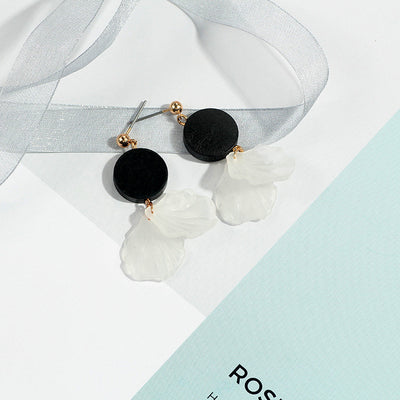 Primary supplied view of black round white-petal studs