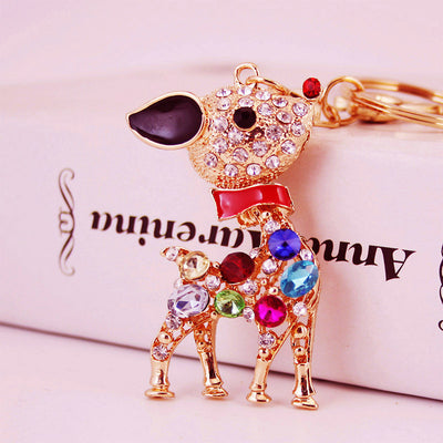 Close-up of a jeweled deer charm with a black ear and colorful body stones.