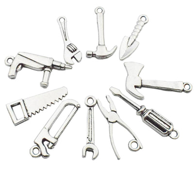 Metallic assorted shape charms arranged on a light background