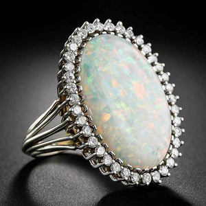 Opalescent Oval Cabochon Halo Ring In Polished Silver Tone