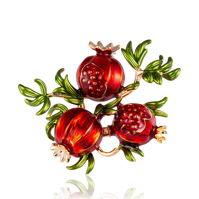 Front product view of the pomegranate brooch pin in red and gold