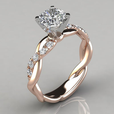 Product view showing round clear solitaire twisted vine ring