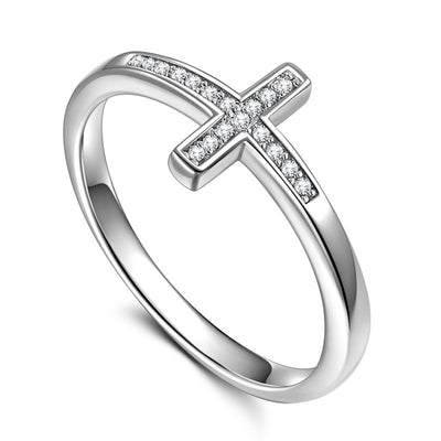 Silver tone micro pavé cross band ring on white background