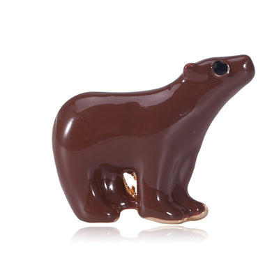 Front product view of the minimal enamel polar bear brooch on a light background
