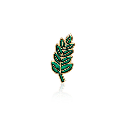 Green enamel gold-outline leaf brooch isolated on white with reflection
