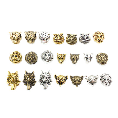 Gold-tone spacer bead beads arranged on a light background