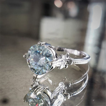 Silver Tone Twisted Ring with Light Blue Round Stone