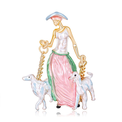 Front product view of the woman walking dogs brooch pin in red and gold
