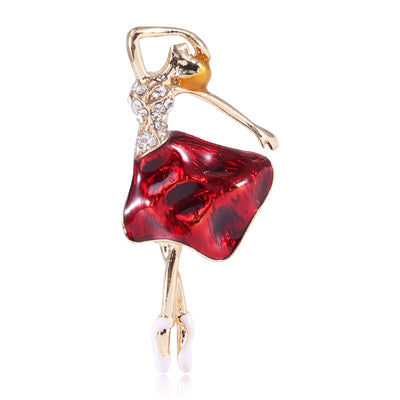 Blue Ballerina, Red Ballerina brooch styles arranged on a light display
