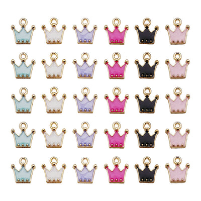 Gold-tone crown charms arranged on a light background