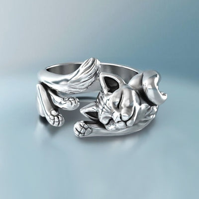 Front silver sleeping cat open ring with fish bone on blue gradient