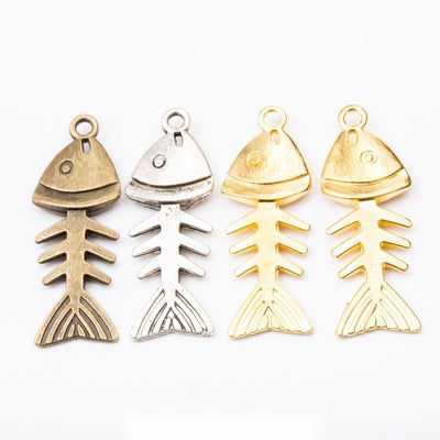 Front display of jointed fish skeleton charm shown against a plain background.
