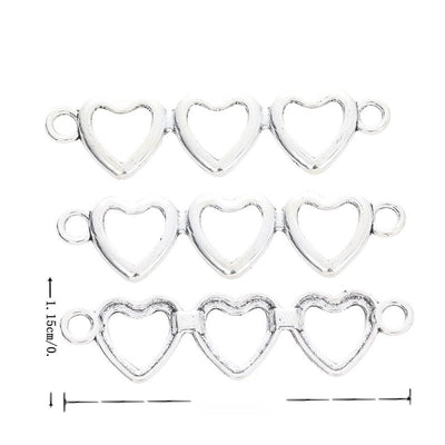 Three linked open hearts with a loop at each end shown in arranged finish comparison