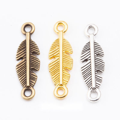 Grouped front views of the double loop feather connector charm in three metal finishes