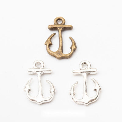 Product view of open anchor charm showing an open anchor silhouette with curved flukes and a round top loop