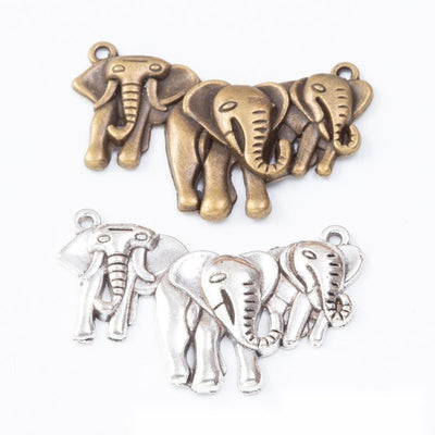 three elephant family metal charms in two finishes shown together in the available finishes