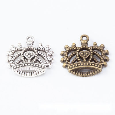 Wide crown with a heart center and open scalloped points shown in the available finishes