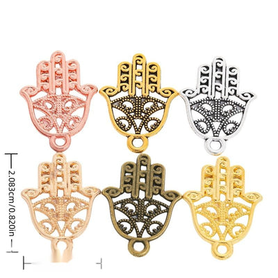 Scrollwork Hamsa Hand metal piece shown in Antique Bronze, Gold, Antique Gold, Antique Silver, KC Gold, Rose Gold beside