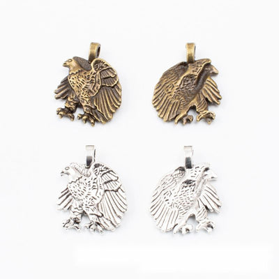 Grouped front views of eagle charms