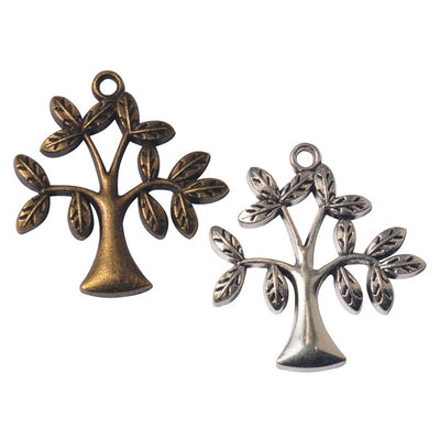 Assorted stylized tree charms arranged together on a white background