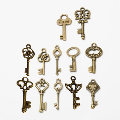 Overview of mixed ornate key charms in the available designs and finishes