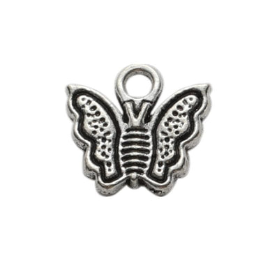 Tiny Framed Butterfly Charm shown in all pictured finishes on a white background
