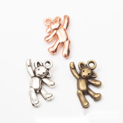 Waving Teddy Bear Charm grouped finish options on a white background