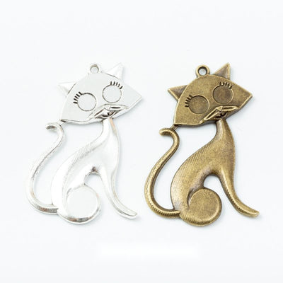 Sitting Cat Charm grouped finish options on a white background