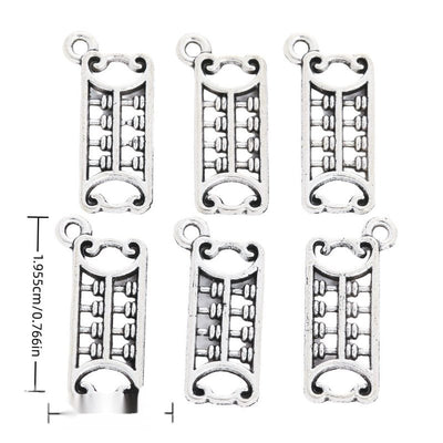 Front and reverse views of long abacus charms with measurement and weight guides