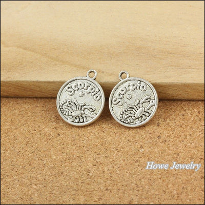 Grouped front views of Scorpio coin charms
