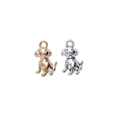 Small sitting puppy metal component, grouped front view on white