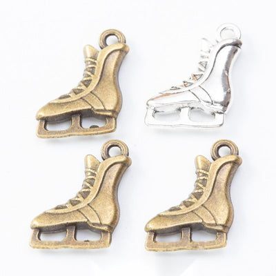 Product photo 1 of the ice skate charm highlighting its lace-up ice skate silhouette with an open blade