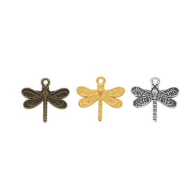 Assorted dragonfly charm pendants displayed together on a white background