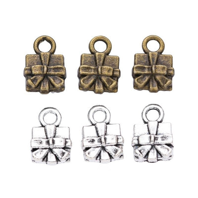 Front-facing arrangement of bow-topped gift box charms on a white background
