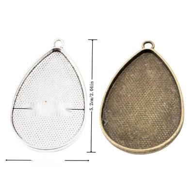 Group view of teardrop recessed cabochon tray with a textured back
