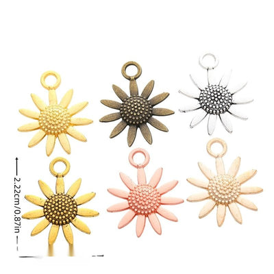Grouped front view of sunflower charm showing a beaded center and radiating petals