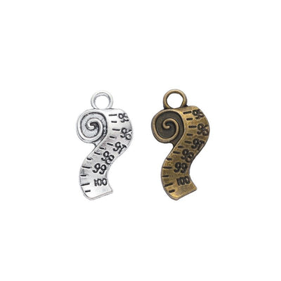 Curled Tape Measure metal piece shown in Antique Bronze, Antique Silver