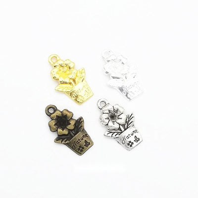 Front comparison of small flower pot metal component in 4 finishes