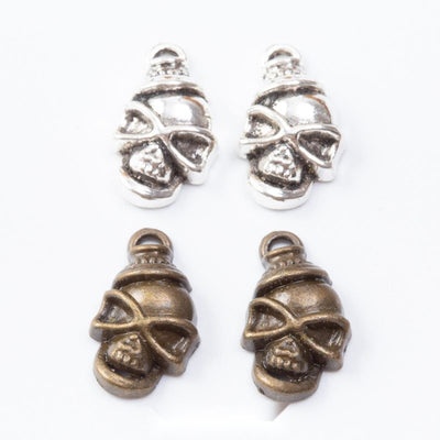 Masked Skull Charm Pendant finish comparison showing a skull face wrapped with a crossed bandana