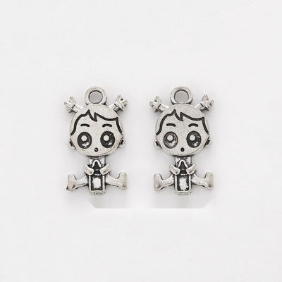 Cartoon Girl Charm shown in the available metal finishes on white
