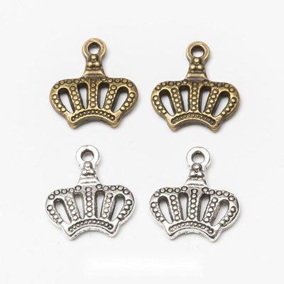 Product view of openwork crown charm showing an openwork royal crown with dotted edging and a top loop