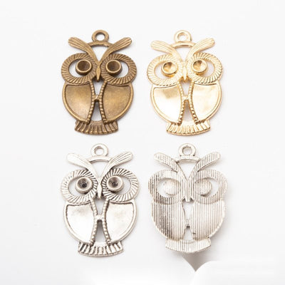 Large Eye Owl metal pieces shown in the available finishes.