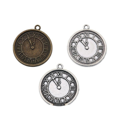 Grouped front views of the roman numeral clock face charm in two antique finishes