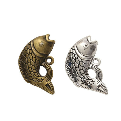 Curved Fish Charm shown in the available metal finishes on white