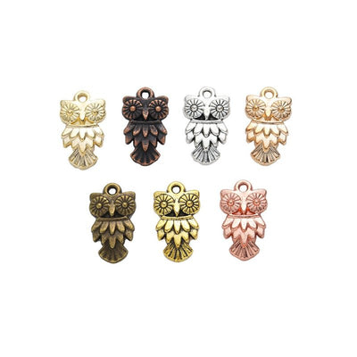 Front comparison of layered owl metal component in 7 finishes