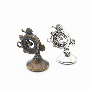 Decorative Horn Charm with Circular Valve Detail in Two Finishes