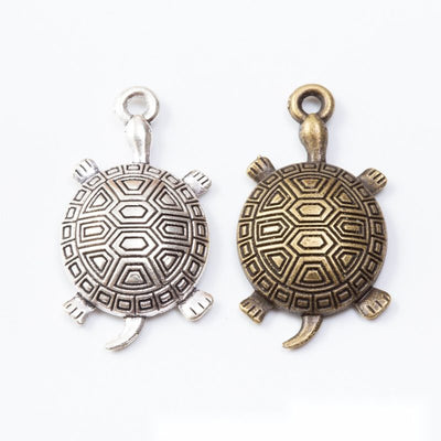 Front view of patterned turtle charm showing finish variation 1