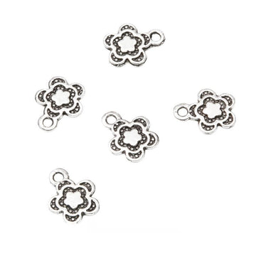 Small Five Petal Flower Outline Charm in Silver Tone