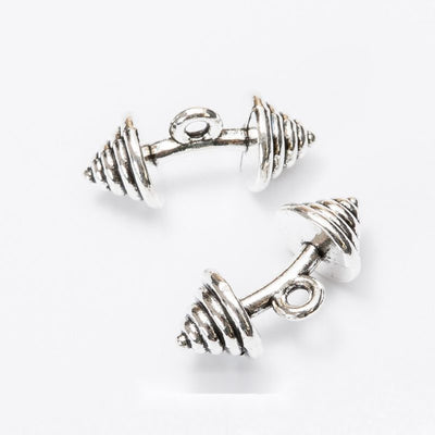 Barbell Charm Pendant finish comparison showing a short bar with stacked pointed weight plates