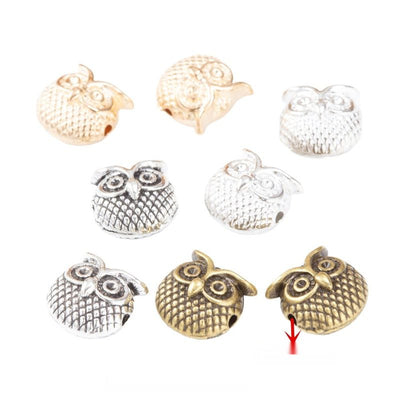 Group view of the owl spacer bead showing the available finishes and front details